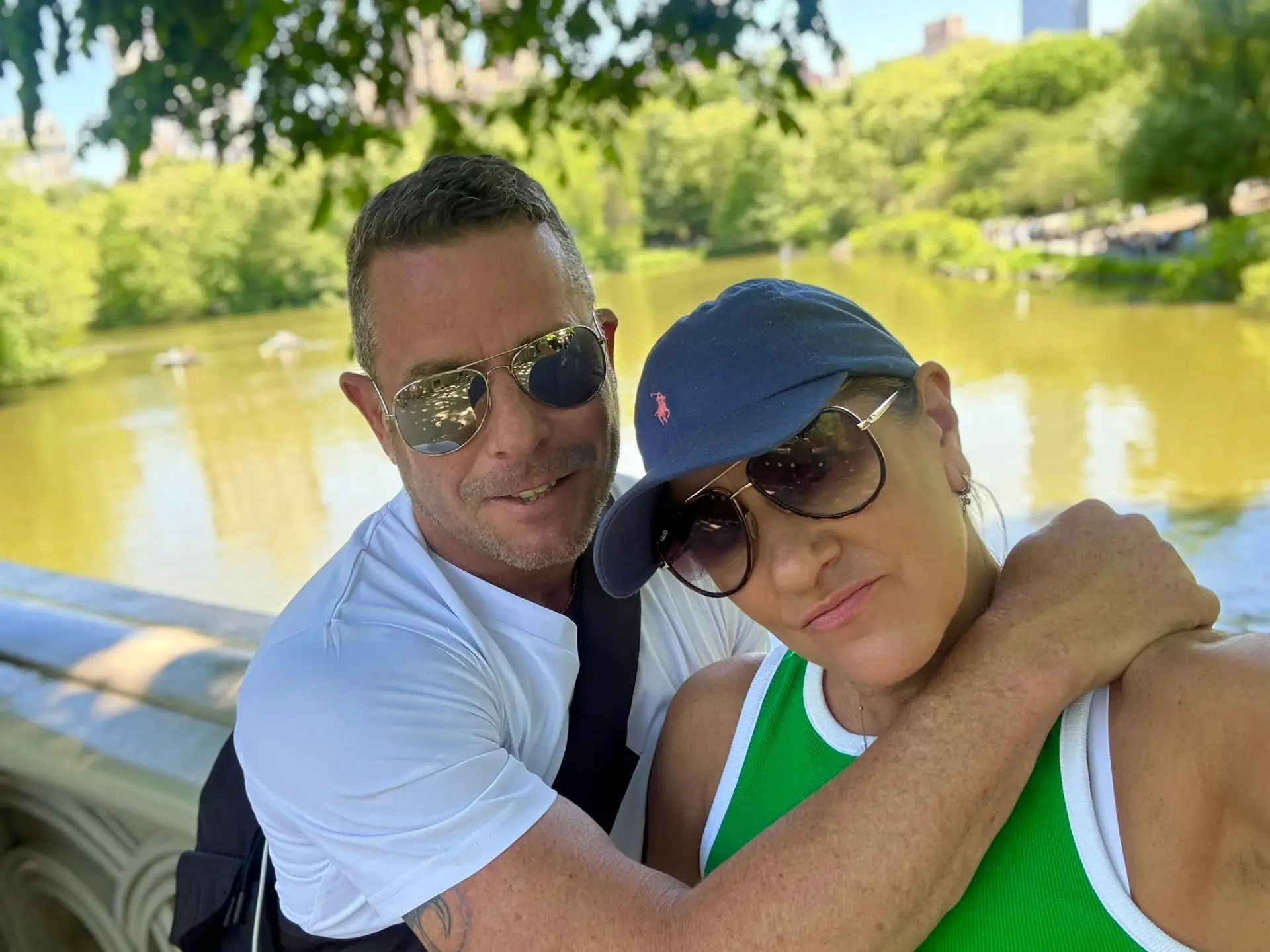 Kerri and Si together beside a park lake