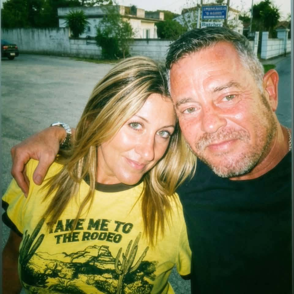 Kerri and Si smiling together on an evening out